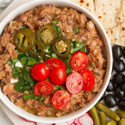  Ful Medames: Uma explosão de sabores terrosos e cremosos que te levará em uma jornada gastronômica pela cidade de Zagazig!